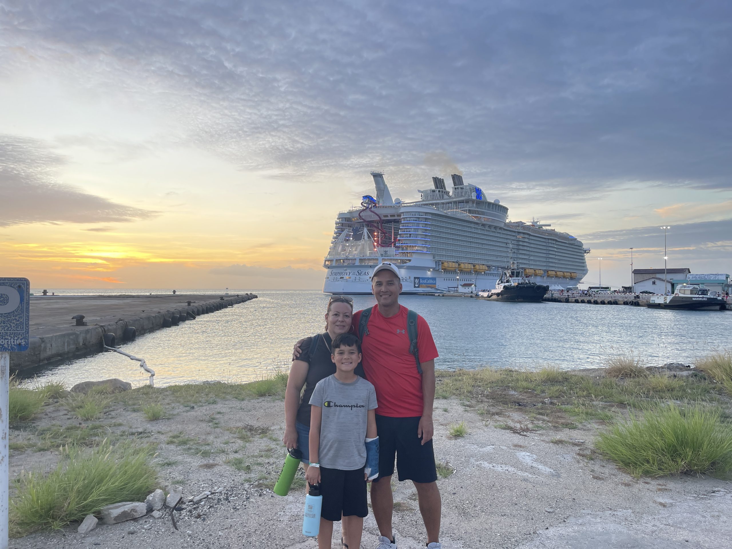 family photo with ship in the background