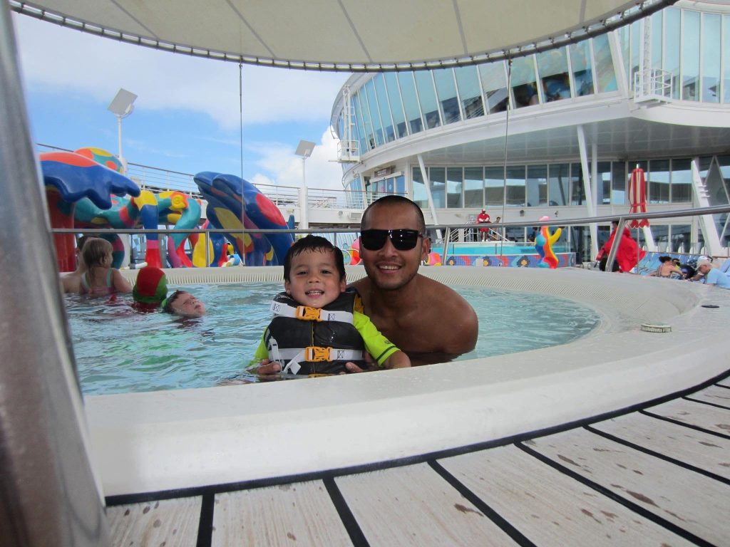 father and son in a hot tub Oasis of the seas