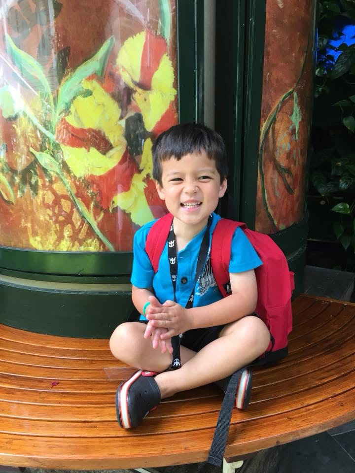 boy sitting and smiling